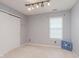 Simple bedroom with closet, natural light, and neutral walls, providing a blank canvas at 2916 Sunmeadow Way, Indianapolis, IN 46228