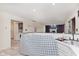 Spacious kitchen with white cabinets and views into an open living area at 2916 Sunmeadow Way, Indianapolis, IN 46228