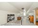 Cozy attic area with white walls, tongue-and-groove ceiling, storage, and plenty of natural light at 311 Northshore Blvd, Anderson, IN 46011