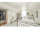 Attic bedroom featuring wood laminate floors, white walls, wardrobe, and metal bed frame at 311 Northshore Blvd, Anderson, IN 46011