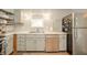 Kitchen featuring updated cabinets, stainless steel appliances, floating wood shelves, and ample counter space at 311 Northshore Blvd, Anderson, IN 46011