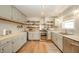 Well-lit kitchen featuring stainless steel appliances, butcher block countertops and ample cabinet space at 311 Northshore Blvd, Anderson, IN 46011