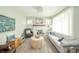 Bright living room boasts stylish decor, including a fireplace, comfortable seating, and elegant light fixtures at 311 Northshore Blvd, Anderson, IN 46011