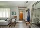 Stylish living room features an open doorway, modern furnishings, and an abundance of natural light at 311 Northshore Blvd, Anderson, IN 46011