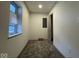 Small bedroom features neutral paint, carpet, a window, and a partial view of the closet at 317 W Pierson St, Greenfield, IN 46140