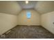 Attic bedroom with new carpet and a window that provides natural light at 317 W Pierson St, Greenfield, IN 46140