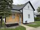 Inviting two-story home with mixed siding and a cozy front porch, perfect for relaxing outdoors at 317 W Pierson St, Greenfield, IN 46140