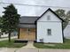 Charming two-story home with mixed siding and a well-maintained front yard on an overcast day at 317 W Pierson St, Greenfield, IN 46140