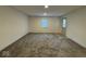 Inviting living room features neutral paint, carpet and natural light from window and door at 317 W Pierson St, Greenfield, IN 46140