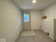 Mud room featuring tile floors, neutral paint, and an exterior door with window at 317 W Pierson St, Greenfield, IN 46140