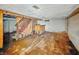 Basement featuring knotty pine accent wall and bar, offering an opportunity to personalize a recreational space at 3615 N Dequincy St, Indianapolis, IN 46218