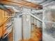 Basement featuring a water heater and brick column in a utilitarian space at 3615 N Dequincy St, Indianapolis, IN 46218