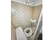 A bathroom showcasing vintage patterned tile and retro fixtures needing renovation to improve its appeal at 3615 N Dequincy St, Indianapolis, IN 46218