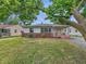 Charming single-story home with red brick accents, white siding, and a well-maintained front yard at 3615 N Dequincy St, Indianapolis, IN 46218