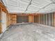 Spacious unfinished garage interior featuring exposed framing and a concrete floor at 3615 N Dequincy St, Indianapolis, IN 46218
