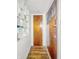 Hallway with storage shelves and an entry door at 3615 N Dequincy St, Indianapolis, IN 46218