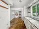 Kitchen with white cabinets and window above the sink at 3615 N Dequincy St, Indianapolis, IN 46218