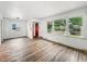 Sunlit living room featuring hardwood floors and bright white walls at 3615 N Dequincy St, Indianapolis, IN 46218