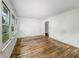 An empty living room with wood floors and a large window for natural light at 3615 N Dequincy St, Indianapolis, IN 46218