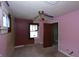 Bedroom with unique ceiling fan, old carpet and exposed walls, ready for personalization and customization at 364 S Cole St, Indianapolis, IN 46241