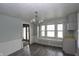 Dining room featuring wood floors, a chandelier, and a sun-filled window seat at 364 S Cole St, Indianapolis, IN 46241