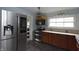 Kitchen featuring stainless steel appliances, tile countertops, and wood floors at 364 S Cole St, Indianapolis, IN 46241