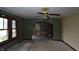 Inviting living room featuring original windows, carpet, and an archway leading to the rest of the home at 364 S Cole St, Indianapolis, IN 46241
