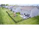 Large, fenced backyard with play set, fire pit, and patio furniture at 3667 Gilmore Pl, Bargersville, IN 46106