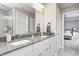 Bright bathroom features a double sink vanity with gray countertop, modern fixtures and gray paint at 3667 Gilmore Pl, Bargersville, IN 46106