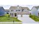 Lovely two-story home with a spacious driveway and beautifully landscaped front yard at 3667 Gilmore Pl, Bargersville, IN 46106