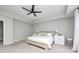 Comfortable main bedroom with a ceiling fan, carpet, and soft lighting creating a cozy atmosphere at 3667 Gilmore Pl, Bargersville, IN 46106
