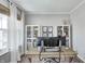 Well-lit home office with large windows, modern furniture, neutral colors, and stylish decor at 3667 Gilmore Pl, Bargersville, IN 46106
