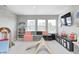 A playroom featuring a modular couch, climbing structure and polka dot wallpaper is a fun, recreational space at 3667 Gilmore Pl, Bargersville, IN 46106