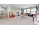 Bright playroom with carpet, natural light, and kid-friendly furniture, ideal for Gathering fun at 3667 Gilmore Pl, Bargersville, IN 46106