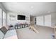 Spacious playroom featuring a comfortable sofa, providing a relaxing space for activities at 3667 Gilmore Pl, Bargersville, IN 46106