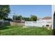 Expansive backyard featuring a lush lawn and a spacious white deck, perfect for outdoor entertaining and relaxation at 3959 Towhees Dr, Indianapolis, IN 46237