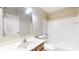Bright bathroom featuring a vanity with marble countertop and shower over tub at 3959 Towhees Dr, Indianapolis, IN 46237