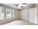 Comfortable bedroom with neutral walls, carpet, and natural light from the multiple windows at 3959 Towhees Dr, Indianapolis, IN 46237