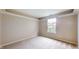 Bedroom featuring neutral-toned walls, carpet, and a window offering natural light and views at 3959 Towhees Dr, Indianapolis, IN 46237