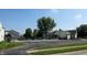 Community pool with lounge chairs and mature trees at 3959 Towhees Dr, Indianapolis, IN 46237