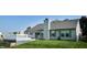 The house has a white deck and a green lawn, and the house is sided in gray with gray shingles at 3959 Towhees Dr, Indianapolis, IN 46237