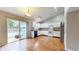 Modern kitchen features white cabinets, granite countertops, stainless steel appliances, and access to a deck at 3959 Towhees Dr, Indianapolis, IN 46237