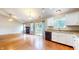 The living room and kitchen have hardwood floors, granite countertops, a fireplace and access to the back yard at 3959 Towhees Dr, Indianapolis, IN 46237