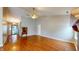 Open-concept living area boasts gleaming hardwood floors, a vaulted ceiling, and seamless flow to the home's entry at 3959 Towhees Dr, Indianapolis, IN 46237