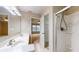 Well-lit main bathroom with double sinks, a shower, and access to the main bedroom at 3959 Towhees Dr, Indianapolis, IN 46237