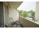 Relaxing balcony featuring a black outdoor table with matching chairs, with a street view at 3965 N Meridian St # 3J West, Indianapolis, IN 46208