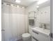 Well-lit bathroom featuring a shower with a curtain, a modern sink, and stylish floor tiles at 3965 N Meridian St # 3J West, Indianapolis, IN 46208