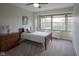 Bedroom featuring carpet floors, a ceiling fan, a closet with folding doors, and a wooden bed frame at 3965 N Meridian St # 3J West, Indianapolis, IN 46208