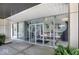 Modern building entrance featuring expansive glass windows with a covered entry at 3965 N Meridian St # 3J West, Indianapolis, IN 46208