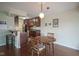 Open dining area with hardwood floors adjacent to kitchen at 3965 N Meridian St # 3J West, Indianapolis, IN 46208